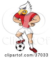 Eagle Mascot In Uniform Standing With His Hands On His Hips And One Foot On A Soccer Ball