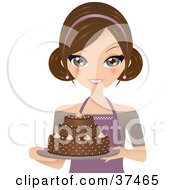 Pretty Female Cake Baker Presenting A Beautiful Chocolate Cake On A Platter