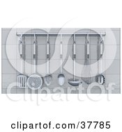 Chrome Kitchen Utensils Hanging From A Rack On A White Tiled Wall