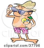 Relaxed Guy In Shorts Holding A Cocktail And Adjusting His Sunglasses While On Vacation