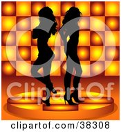Two Sexy Black Silhouetted Women Standing Back To Back On A Platform Over An Orange Circle Patterned Background