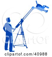 Blue Silhouetted Camera Man Operating A Boom In A Studio