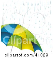 Poster, Art Print Of Rain Showers Pouring Down On A Blue Yellow And Green Umbrella