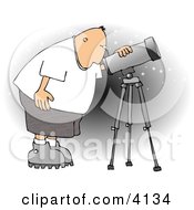 Male Astronomer Looking At The Sky Through A Telescope