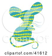 Clipart Illustration Of A Blue And Yellow Dot Patterned Mouse by Prawny