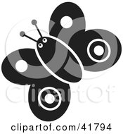 Clipart Illustration Of A Black And White Butterfly With Round Markings by Prawny