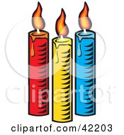 Poster, Art Print Of Three Colorful Burning And Melting Candles