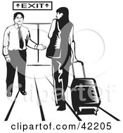 Male Airport Attendant Directing A Woman To An Exit