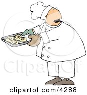 Male Baker Looking Over His Shoulder While Holding A Tray Of Raw Cinnamon Rolls Clipart