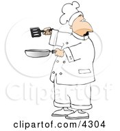Male Chef Holding A Skillet And Spatula