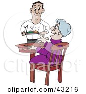 Sweet Man Serving An Elderly Lady Dinner In A Retirement Home