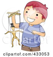 Boy Playing With A Puppet