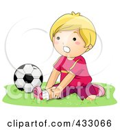 Poster, Art Print Of Boy Stretching By A Soccer Ball