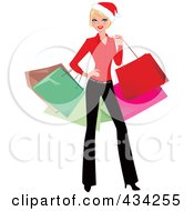 Blond Christmas Woman Posing And Carrying Colorful Shopping Bags