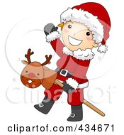 Poster, Art Print Of Christmas Boy In A Santa Suit Playing With A Stick Pony