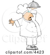 Professional Male Chef Carrying A Covered Serving Plate