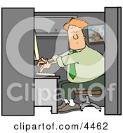 Computer Programmer Working At A Business Firm On A Computer In His Cubicle Clipart