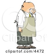 Restaurant Food Handler Wearing An Apron And Picking His Nose For Boogers