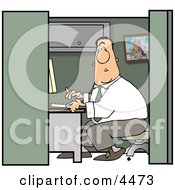 Male Computer Programmer Working In Typing On Computer Keyboard In His Cubicle Clipart