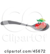 Two Bing Cherries Resting On A Spoon