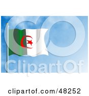 Waving Algeria Flag Against A Blue Sky