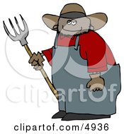 Smiling Mexican Cowboy Farmer Holding A Pitchfork