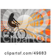 Bicyclist Silhouette Against A Gray Sunburst With Orange Dots
