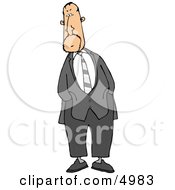 Alert Businessman Standing And Waiting With Hands In Pockets