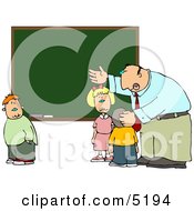 Elementary Male School Teacher Explaining To Students In Front Of A Chalkboard Clipart
