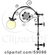 Ornate Wrought Iron Lamp With A Rounded Glass Covering