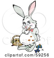 Poster, Art Print Of Chubby Easter Bunny With Chocolate Smears On Its Fur Standing By A Basket And Candy Wrappers