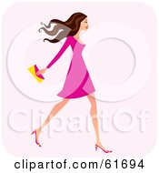 Poster, Art Print Of Fashionable Brunette Woman Walking And Carrying A Clutch Purse