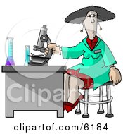 Female Scientist Using A Microscope In A Laboratory