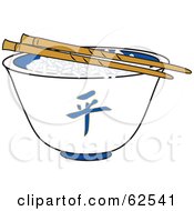 Pair Of Chopsticks Over Rice In A White Chinese Bowl
