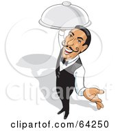 Friendly Male Waiter Holding Out One Hand And Carrying A Platter