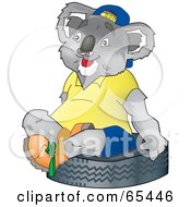 Poster, Art Print Of Koala Sitting On A Tire