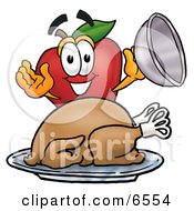 Red Apple Character Mascot With A Cooked Thanksgiving Turkey On A Platter by Mascot Junction