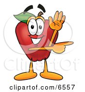 Red Apple Character Mascot Waving And Pointing To The Right