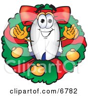 Blimp Mascot Cartoon Character In The Center Of A Christmas Wreath by Mascot Junction