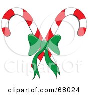 Royalty Free RF Clipart Illustration Of Crossed Christmas Candy Canes With A Green Bow