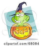 Happy Frog Popping Out Of A Carved Halloween Pumpkin On Blue