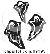 Three Black And White Ghosts With Skull Heads