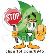 Clipart Picture Of A Leaf Mascot Cartoon Character Holding A Stop Sign by Toons4Biz