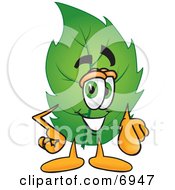 Clipart Picture Of A Leaf Mascot Cartoon Character Pointing At The Viewer by Toons4Biz