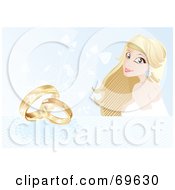 Beautiful Blond Bride On A Blue Background With Wedding Rings