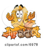 Clipart Picture Of A Badge Mascot Cartoon Character With Autumn Leaves And Acorns In The Fall