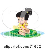 Little Girl Sitting On A Lily Pad With A Lotus