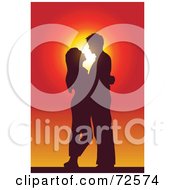 Poster, Art Print Of Couple Standing Embracing And Gazing At Each Other And Silhouetted Against A Sunset