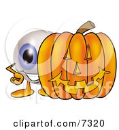 Eyeball Mascot Cartoon Character With A Carved Halloween Pumpkin