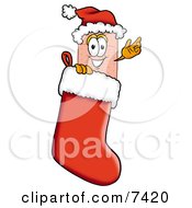 Clipart Picture Of A Bandaid Bandage Mascot Cartoon Character Wearing A Santa Hat Inside A Red Christmas Stocking